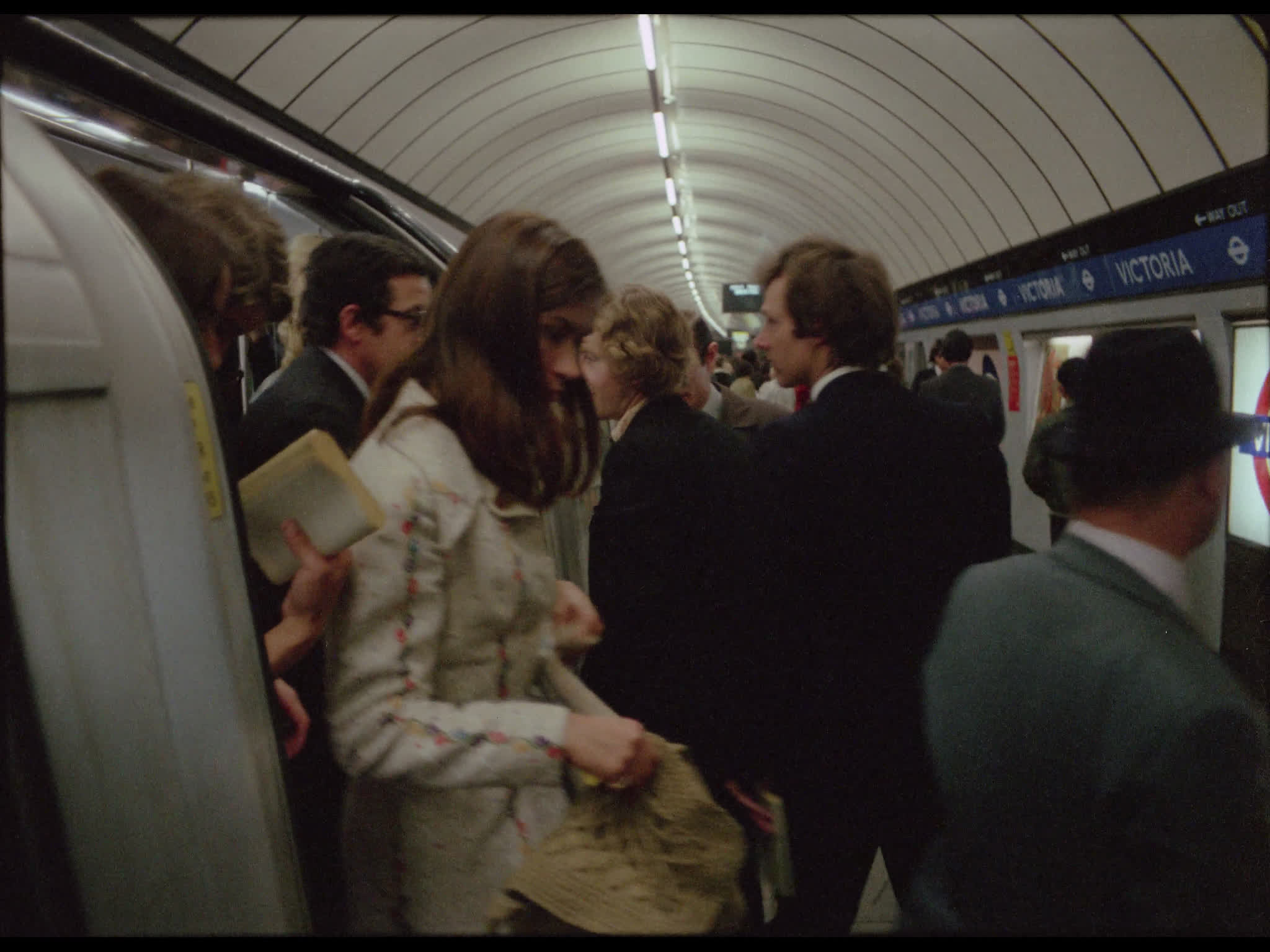 Passengers exciting Tube at Victoria Station