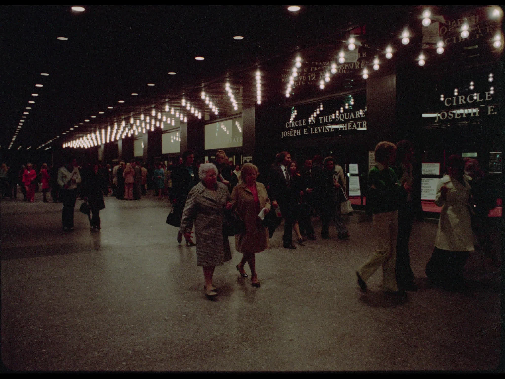 Crowds walk past the Circle in the Square Theatre