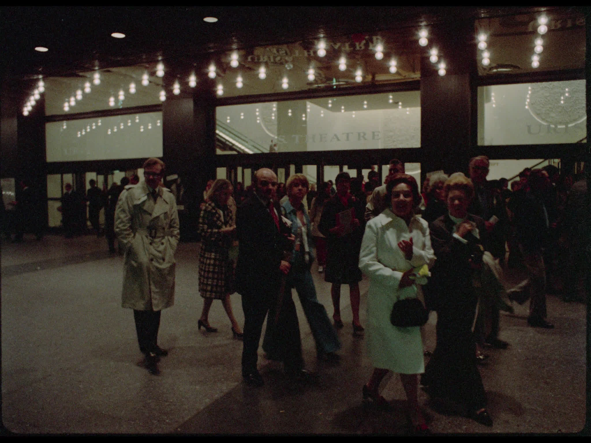 Crowds walk past the Circle in the Square Theatre