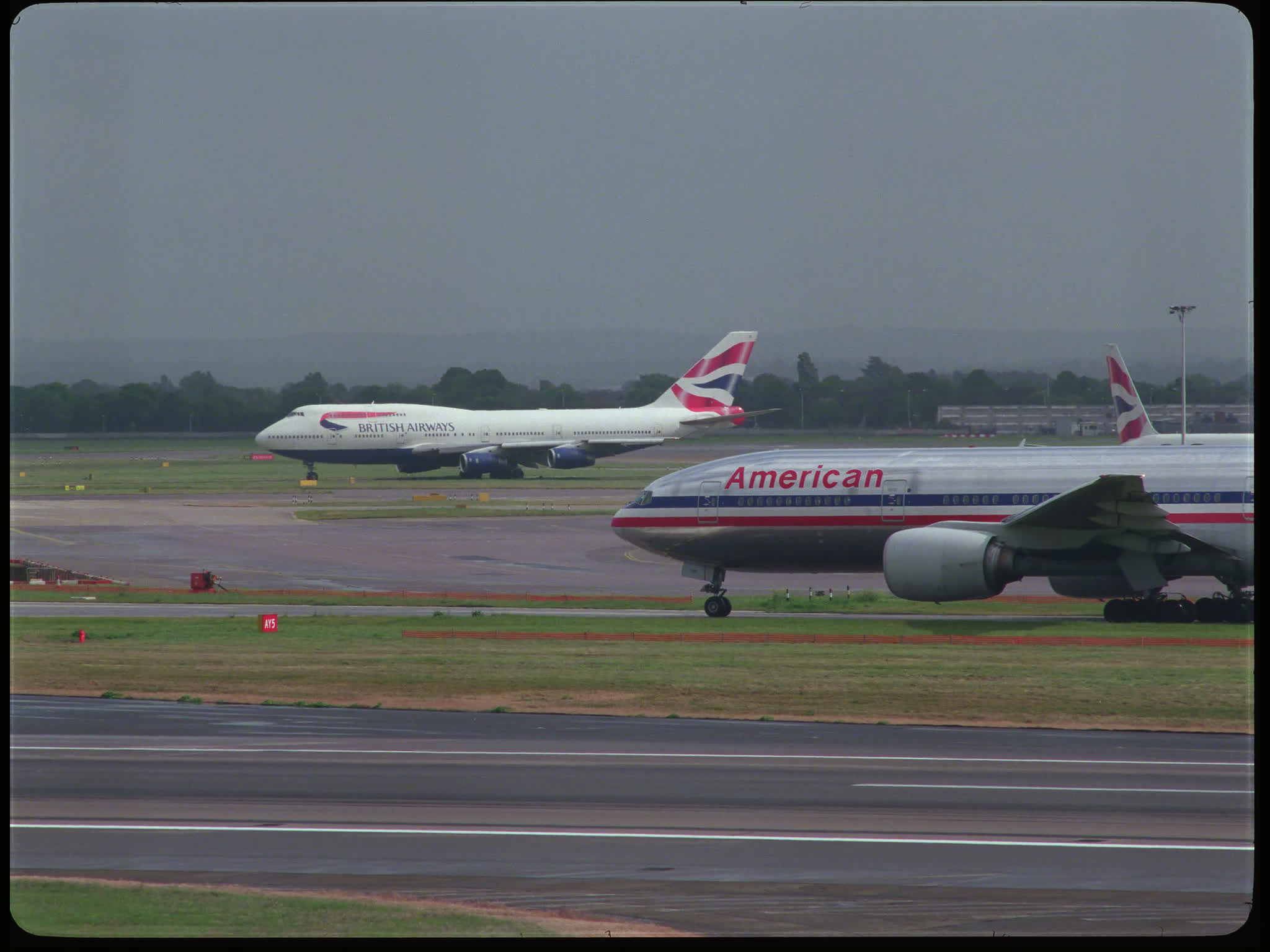 American Airlines Boeing 777 and British Airways Boeing 747 Taxiing