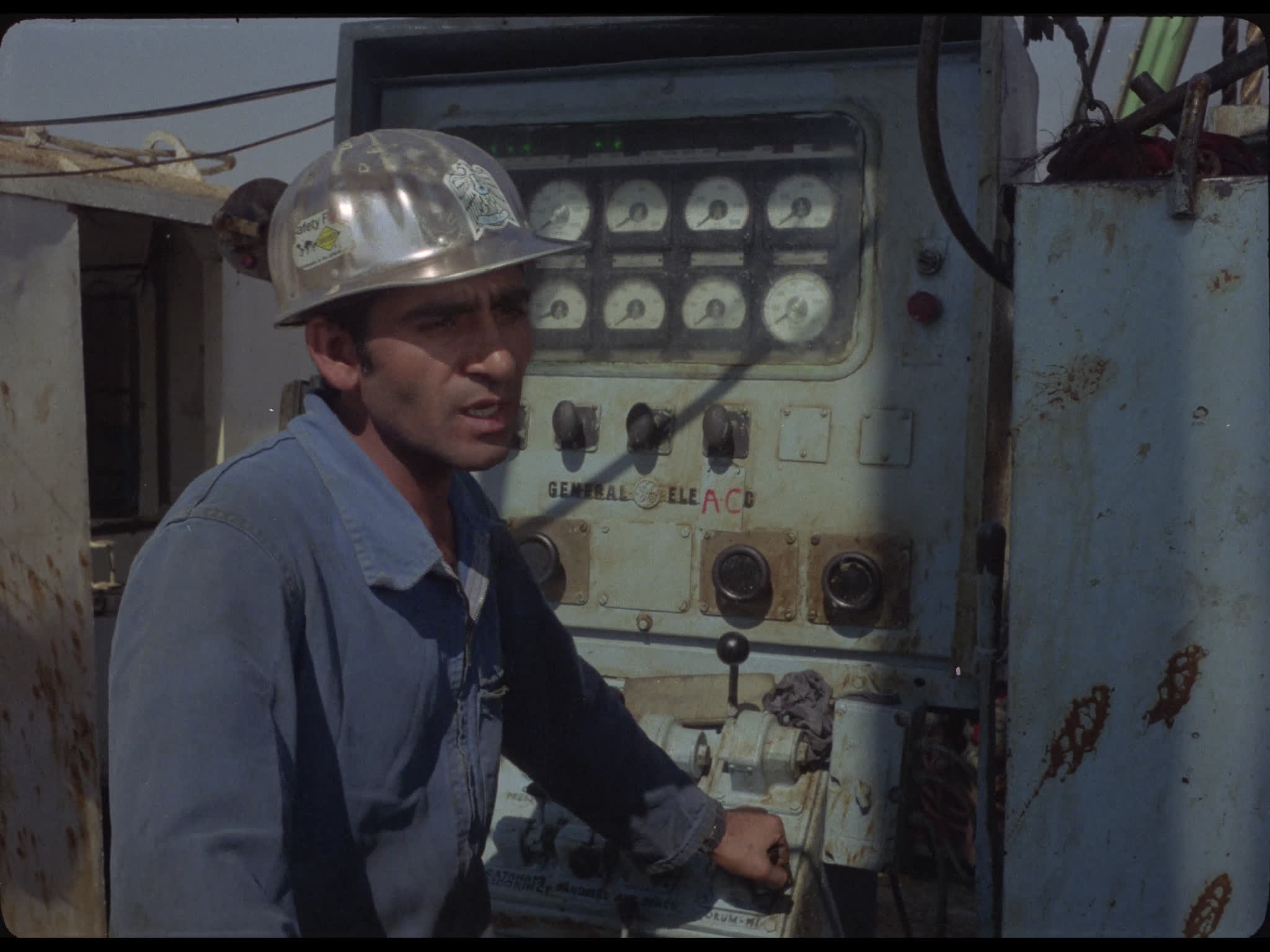 Man By Control Unit on Oil Platform