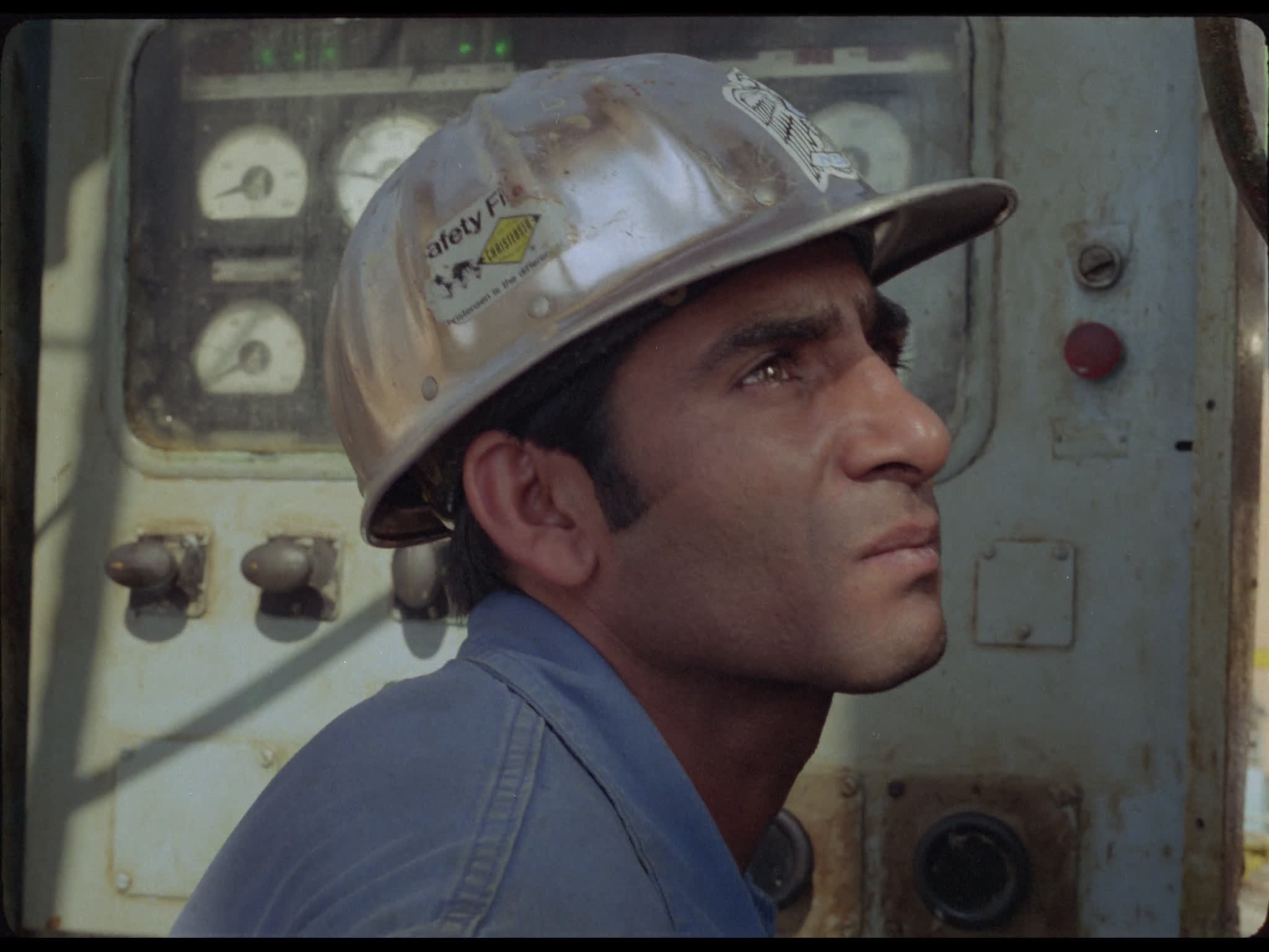 Man By Control Unit on Oil Platform