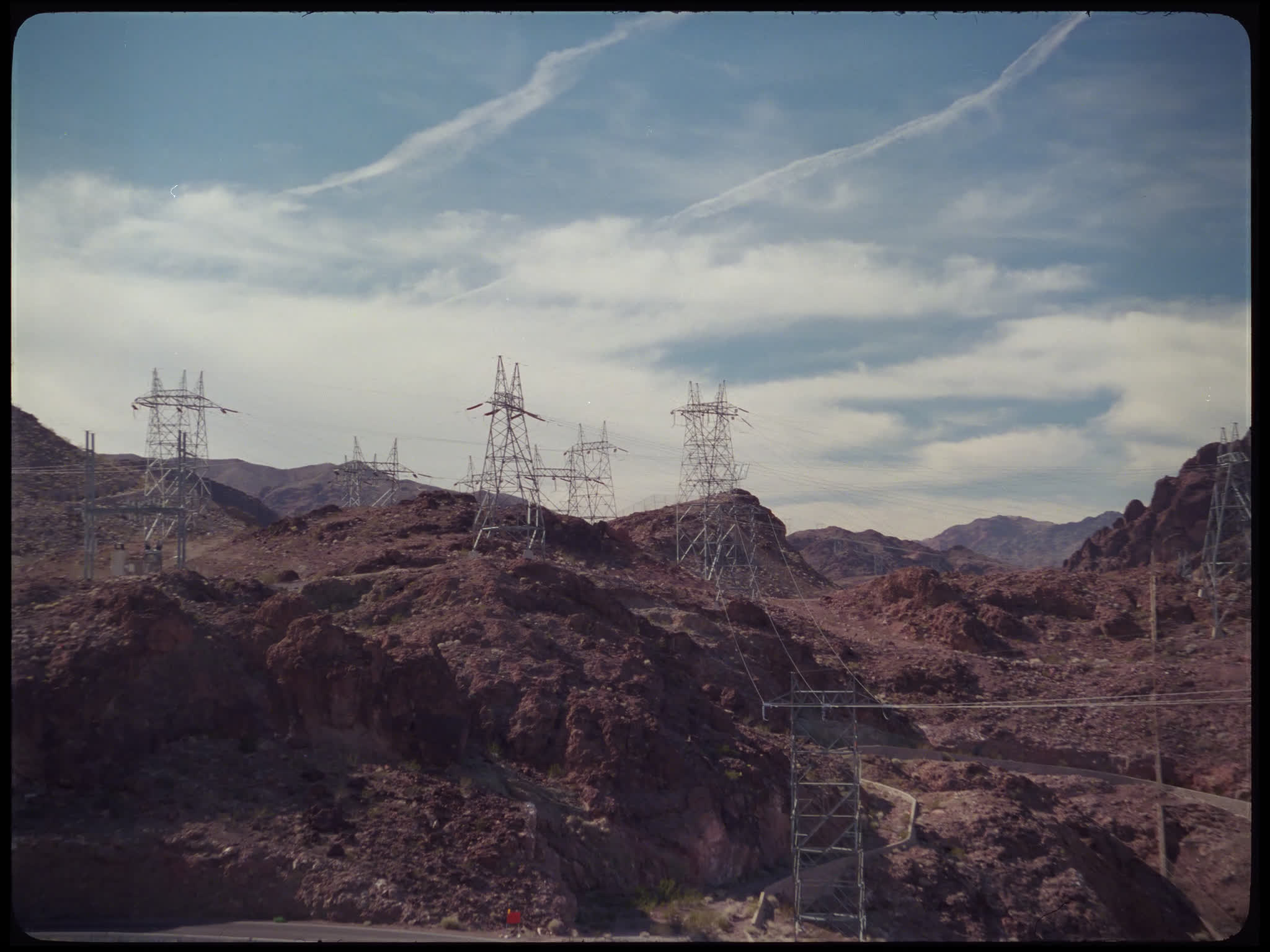 Electricity Pylons on Rocky Hillside