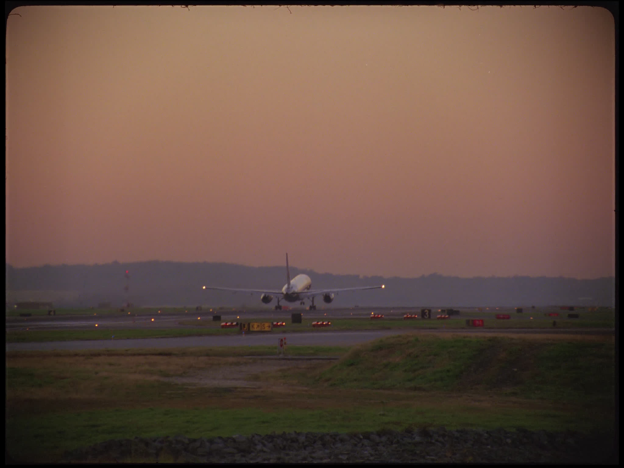 Unidentifiable Twin Engine Aircraft Takes Off