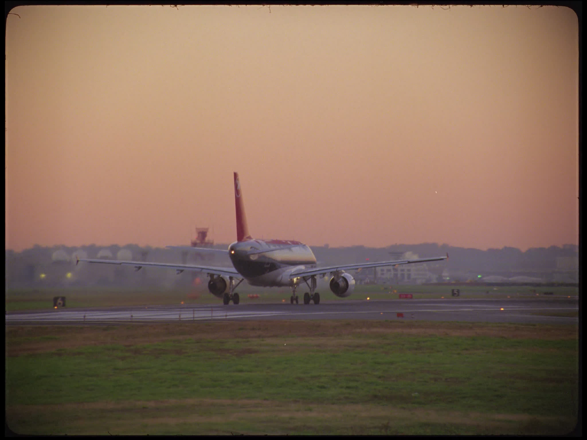 Northwest Airbus A320 Heads Down Runway to Take Off