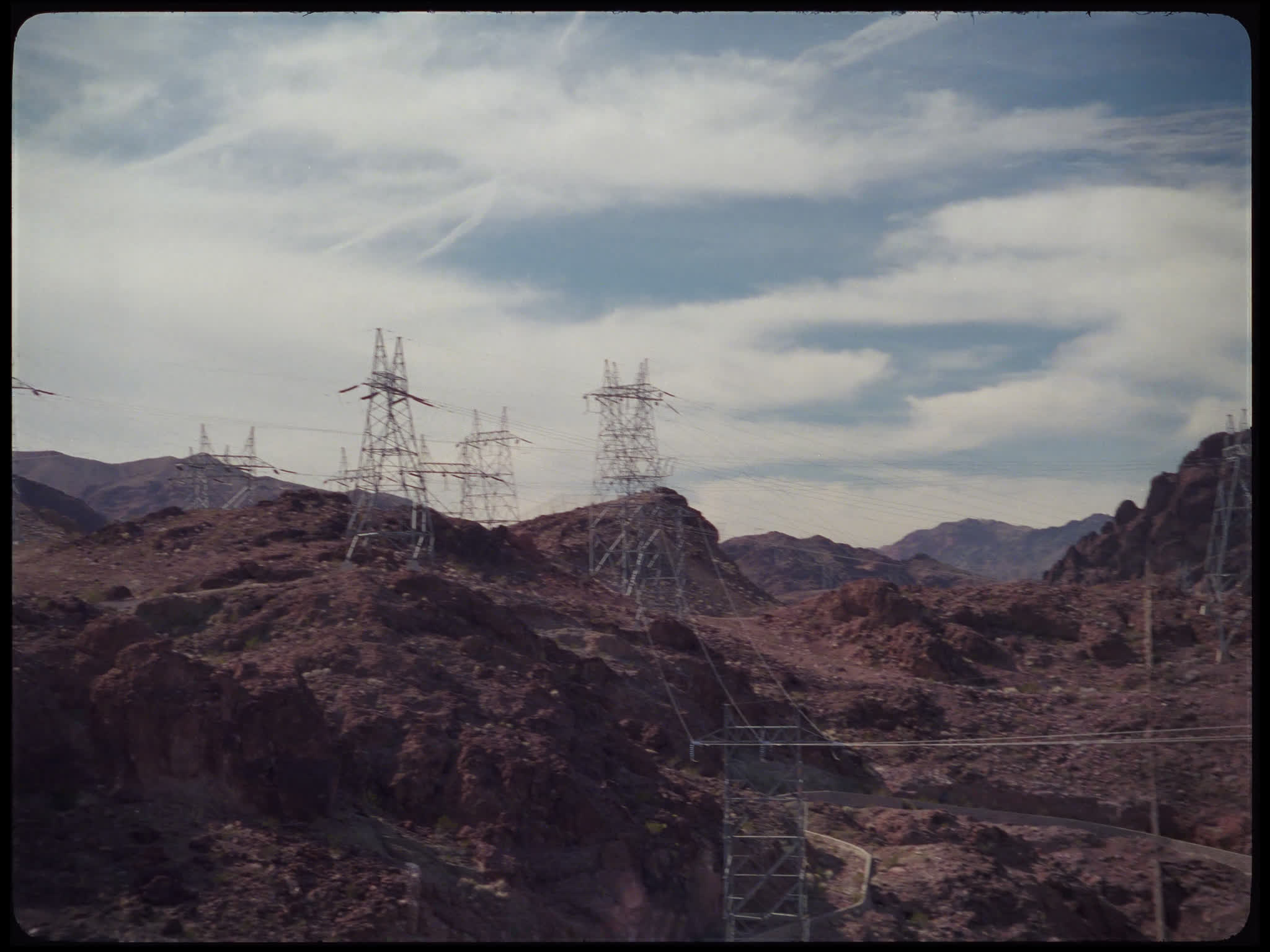 Electricity Pylons on Rocky Hillside