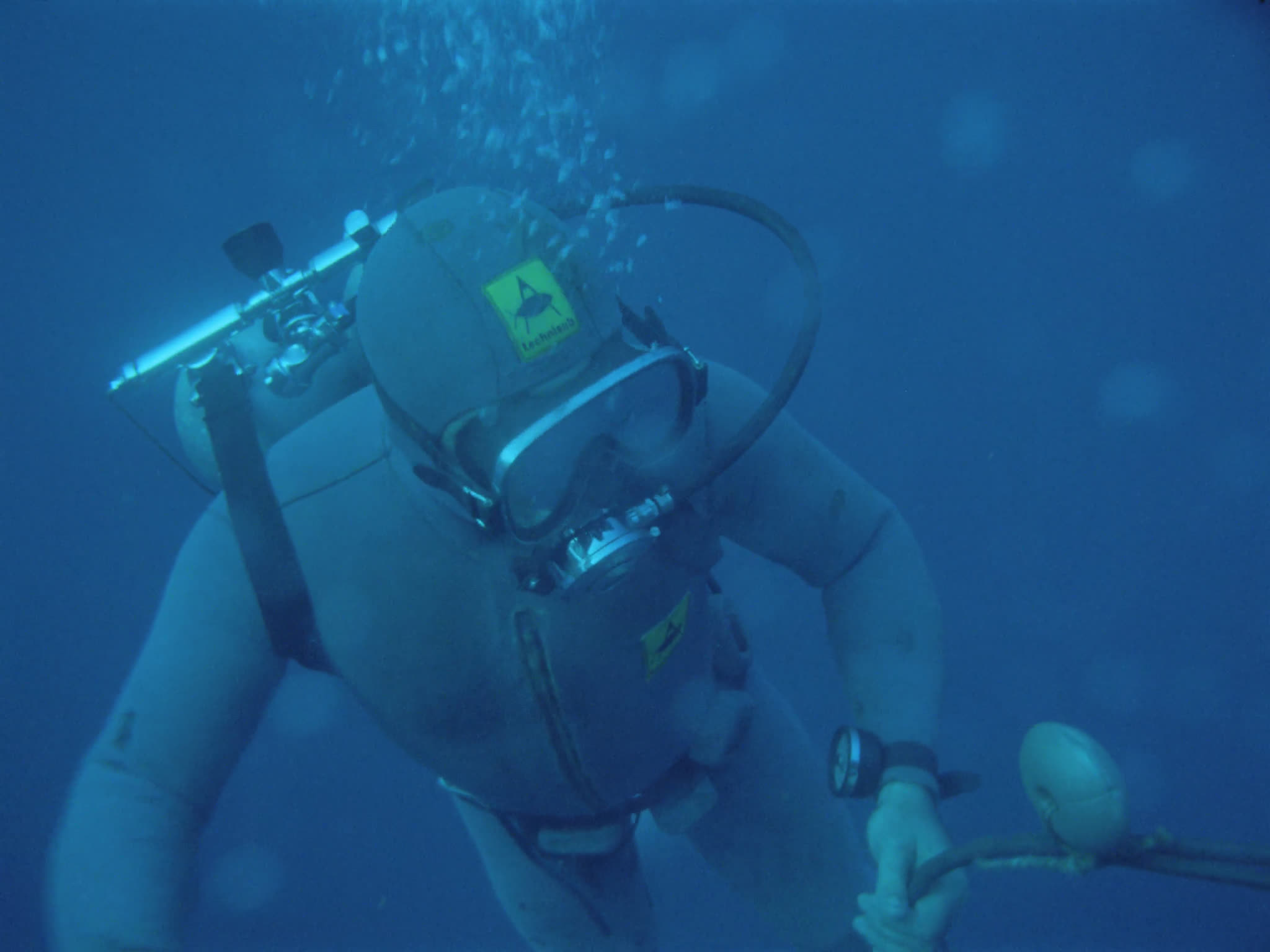 Divers Inspecting Oil Pipes