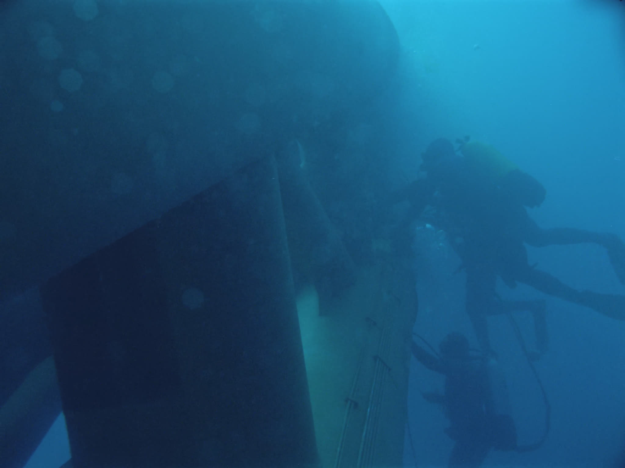 Divers Inspecting Oil Pipes