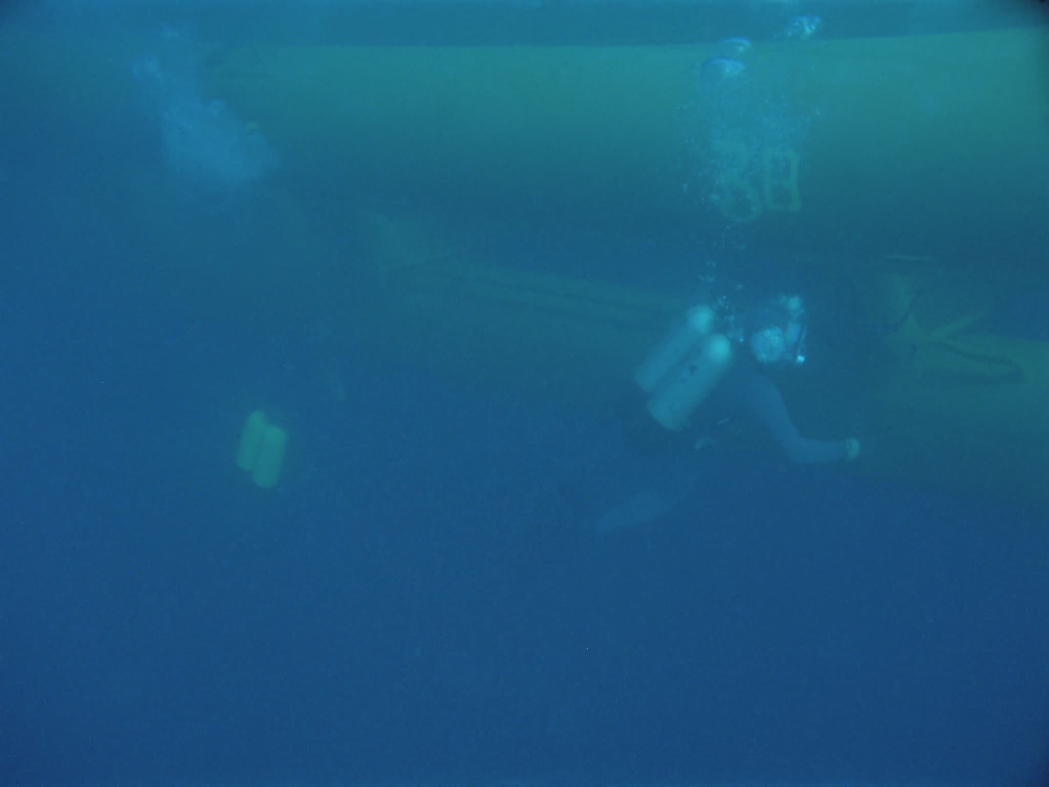 Divers Inspecting Oil Pipes