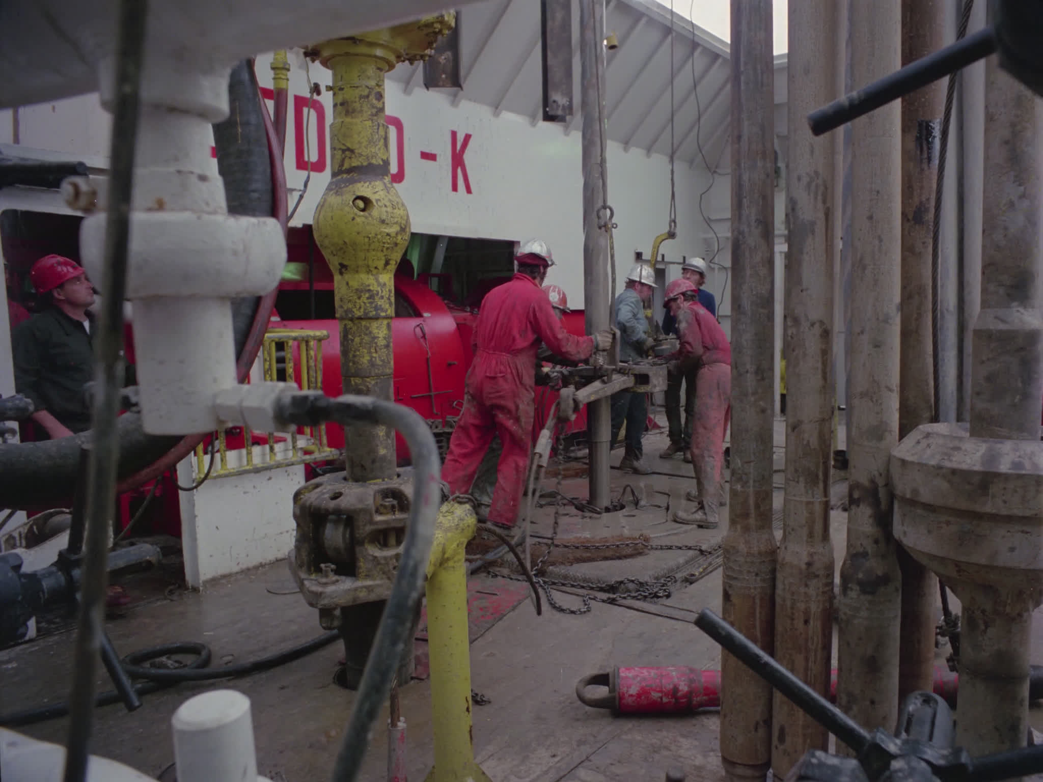 Workers Working on the Drill Deck of an Oil Rig