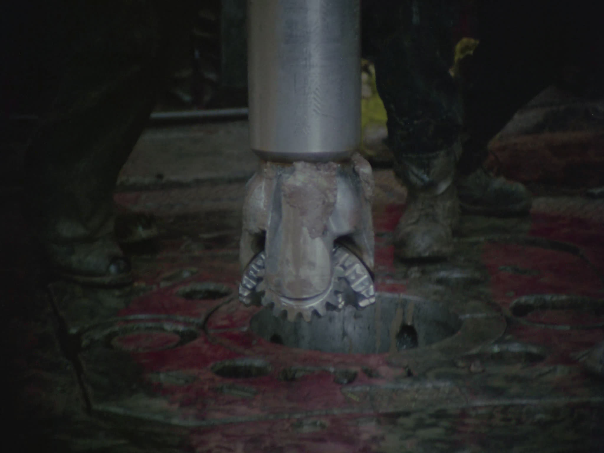 Drill Bit Being Lowered From Drill Deck of Oil Rig