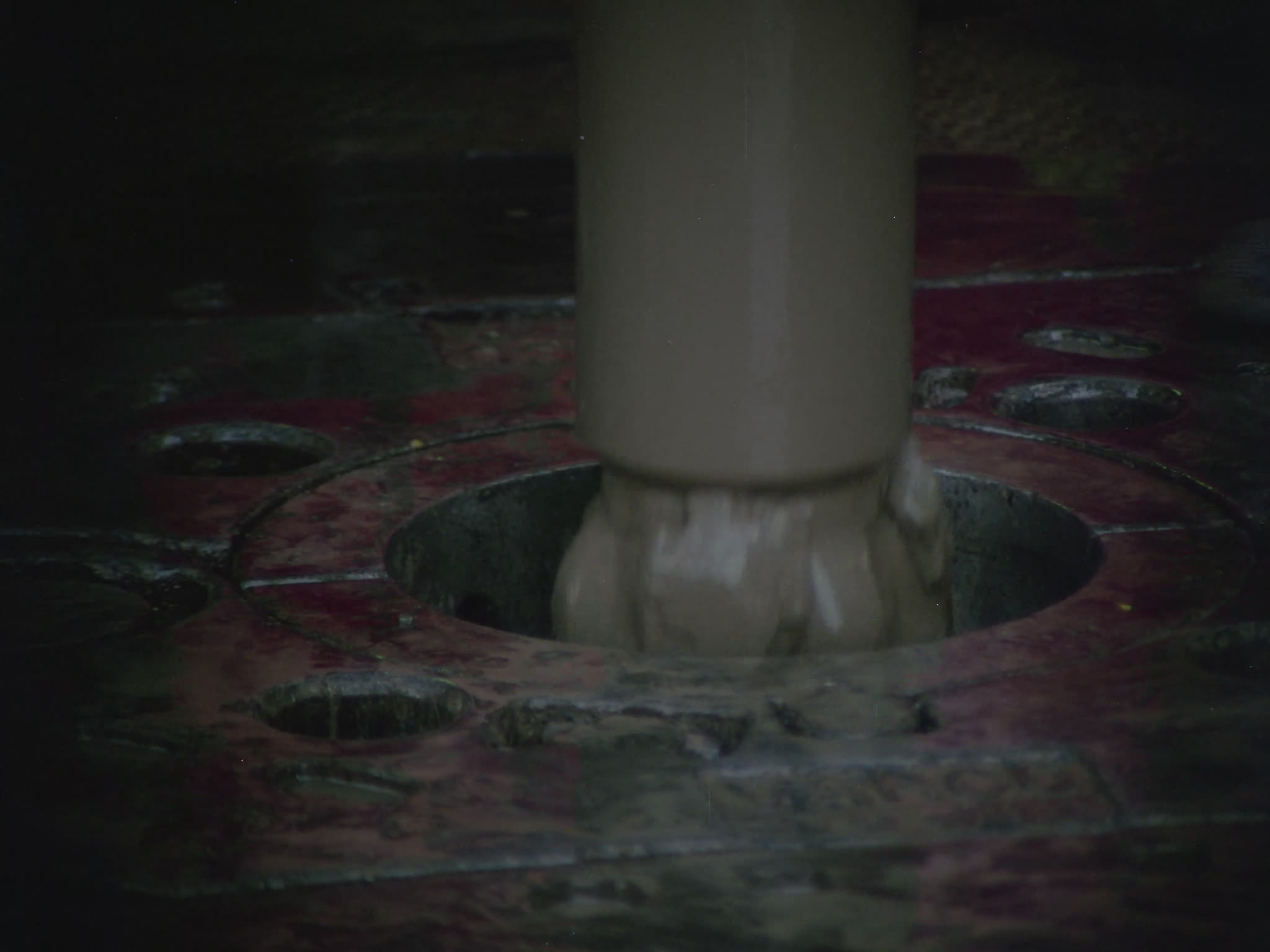 Drill Bit Being Removed From Drill Deck of Oil Rig