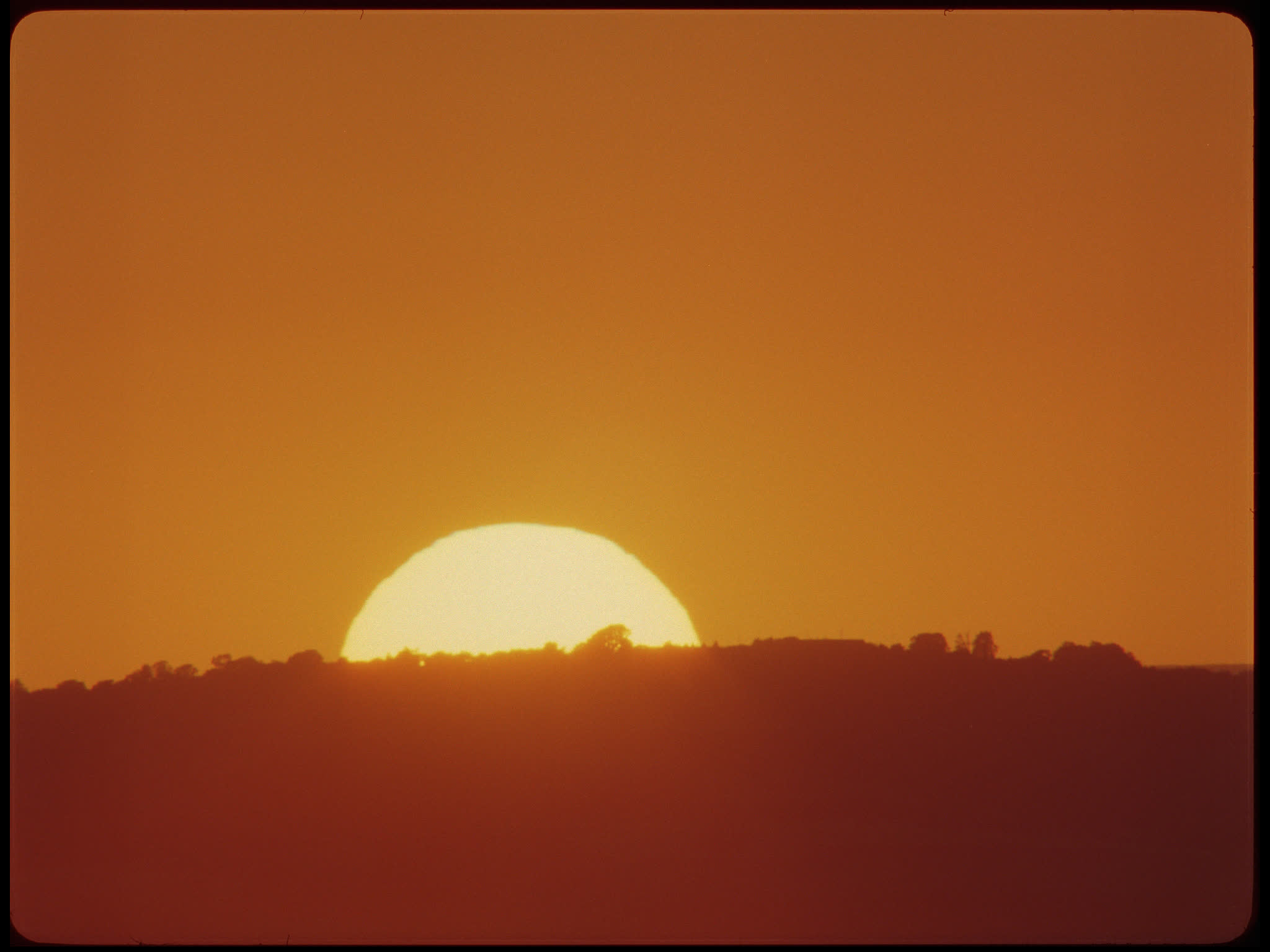 Time Lapse Sunset Behind Hill