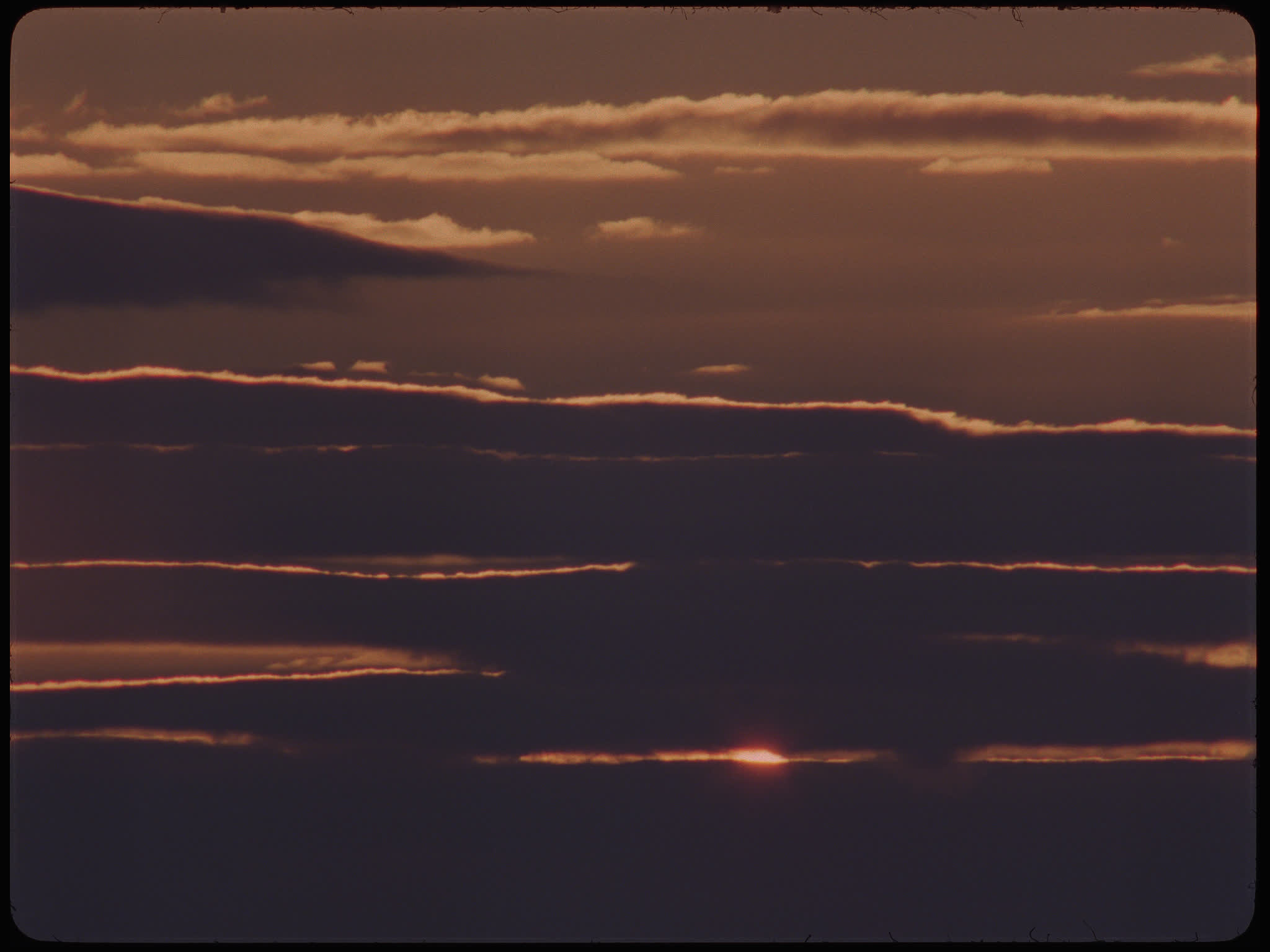 Time Lapse Sunset Behind Clouds