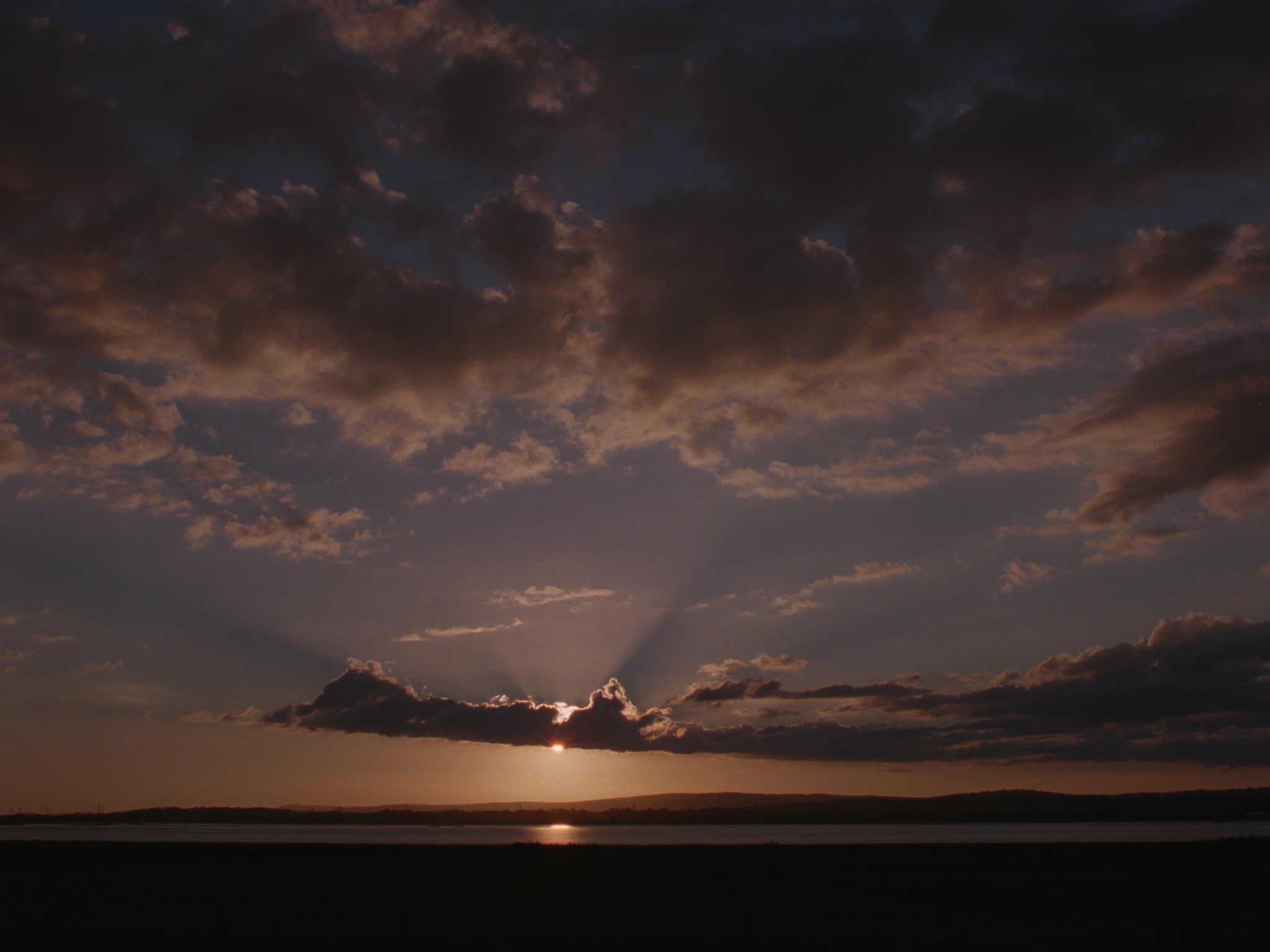 Sun Behind Clouds