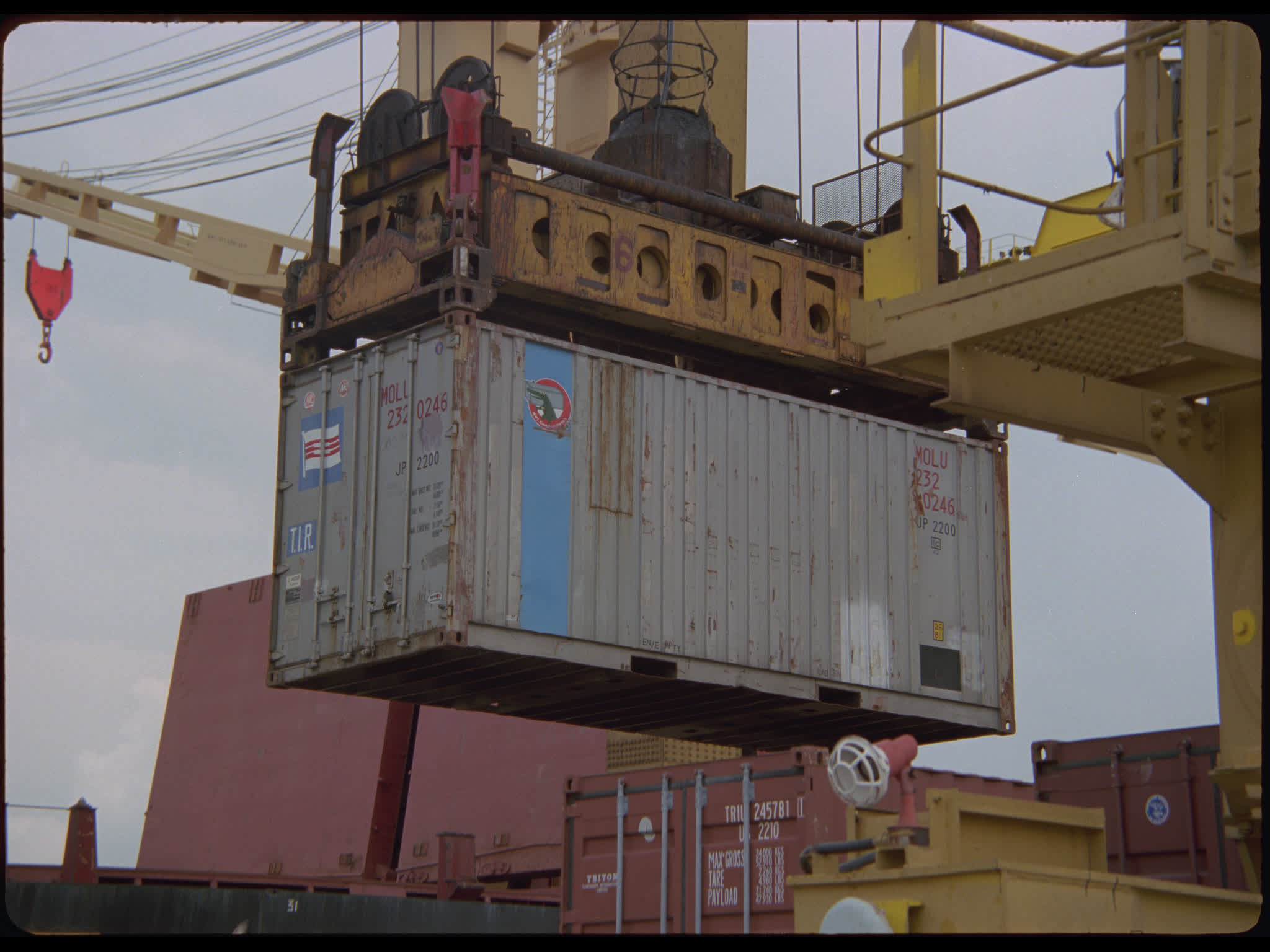 Shipping Container Hoisted From Truck