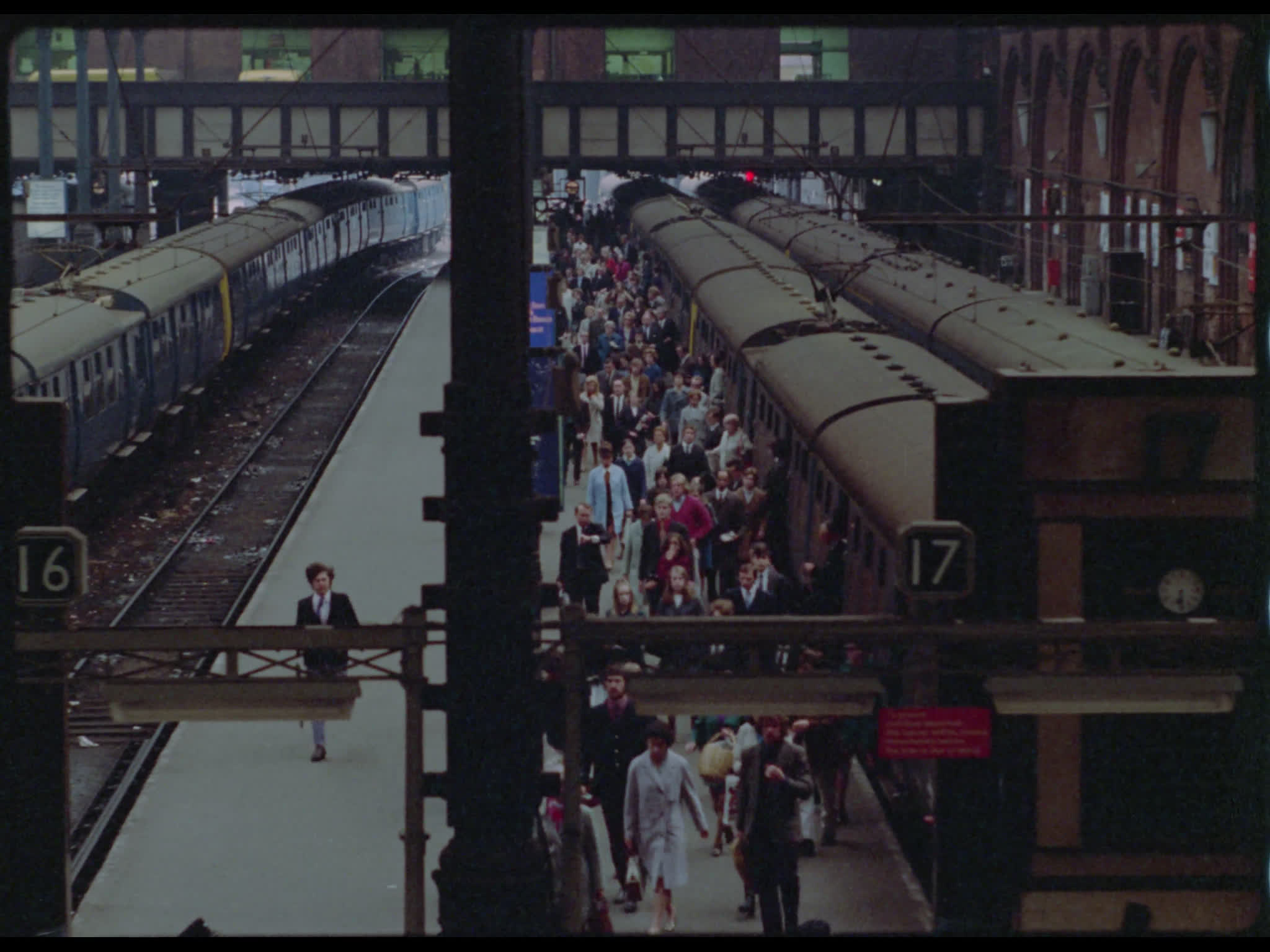 Crowds Leaving Train and Train Departing