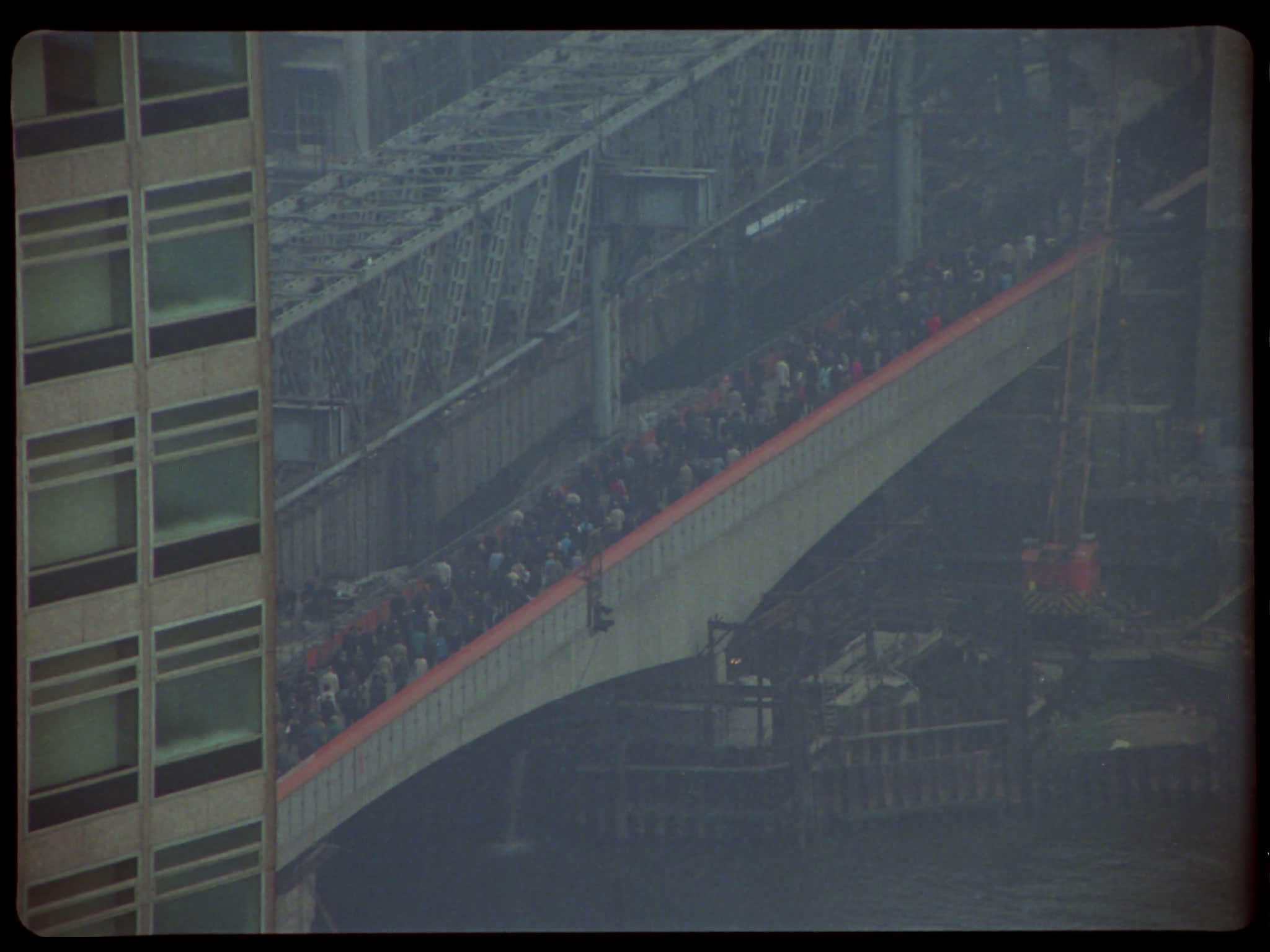 Commuters Crossing Bridge