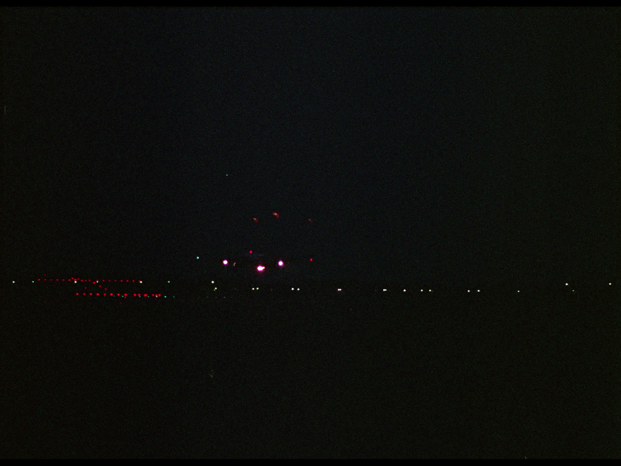 KLM Electra Plane Landing at Night