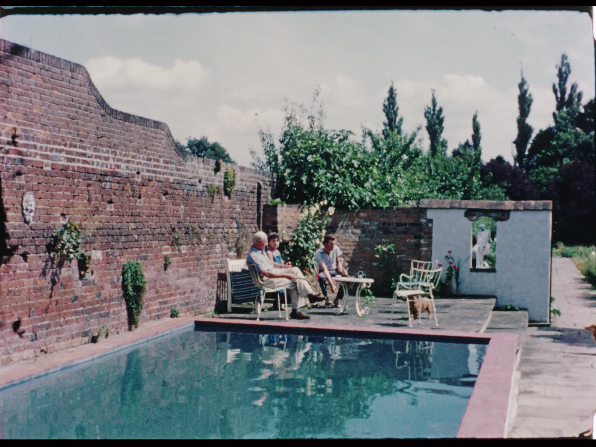 Dirk Bogarde and His Parents by the Pool
