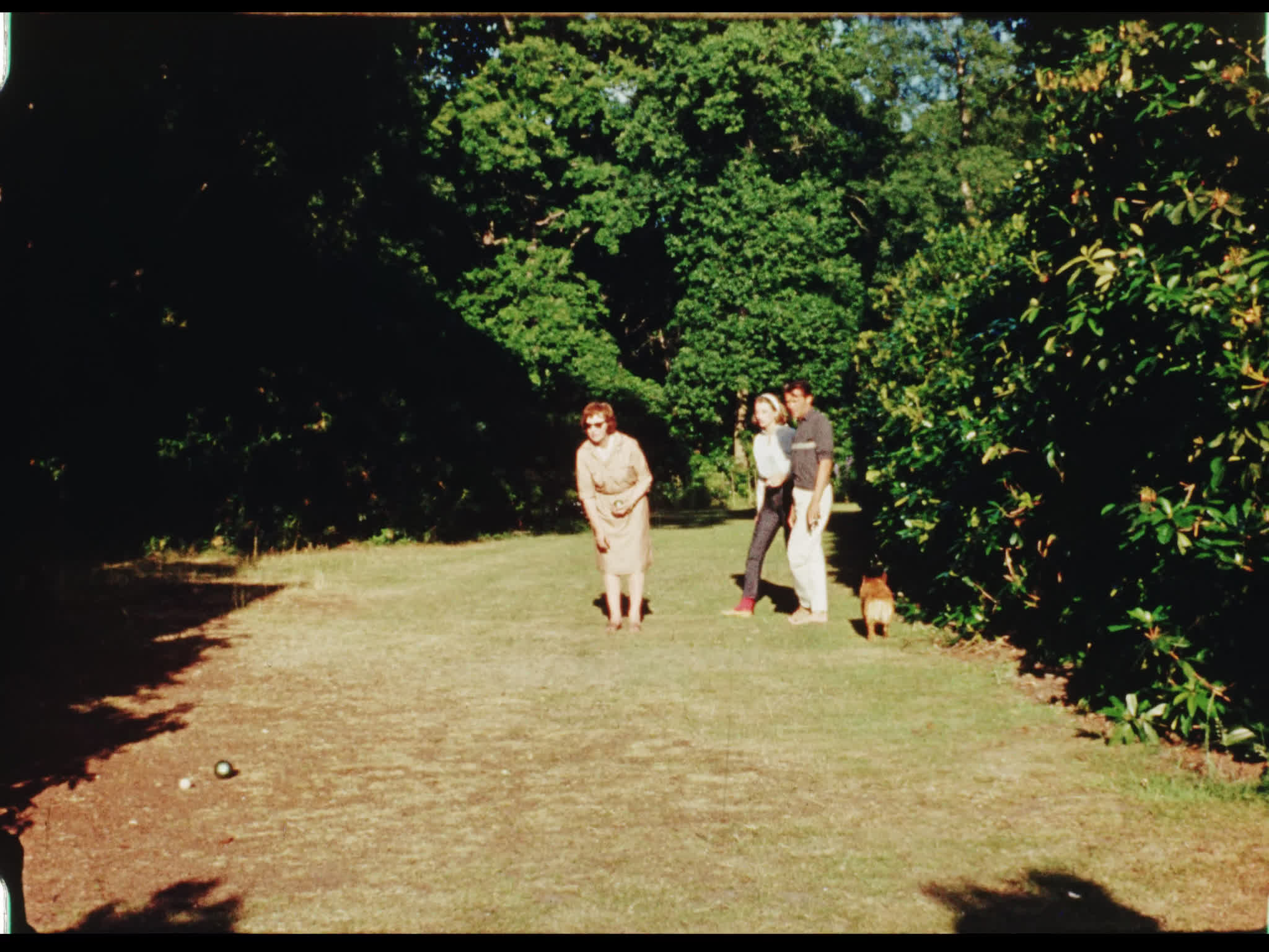 Dirk Bogarde, Irene Howard, and Capucine Playing Bowls