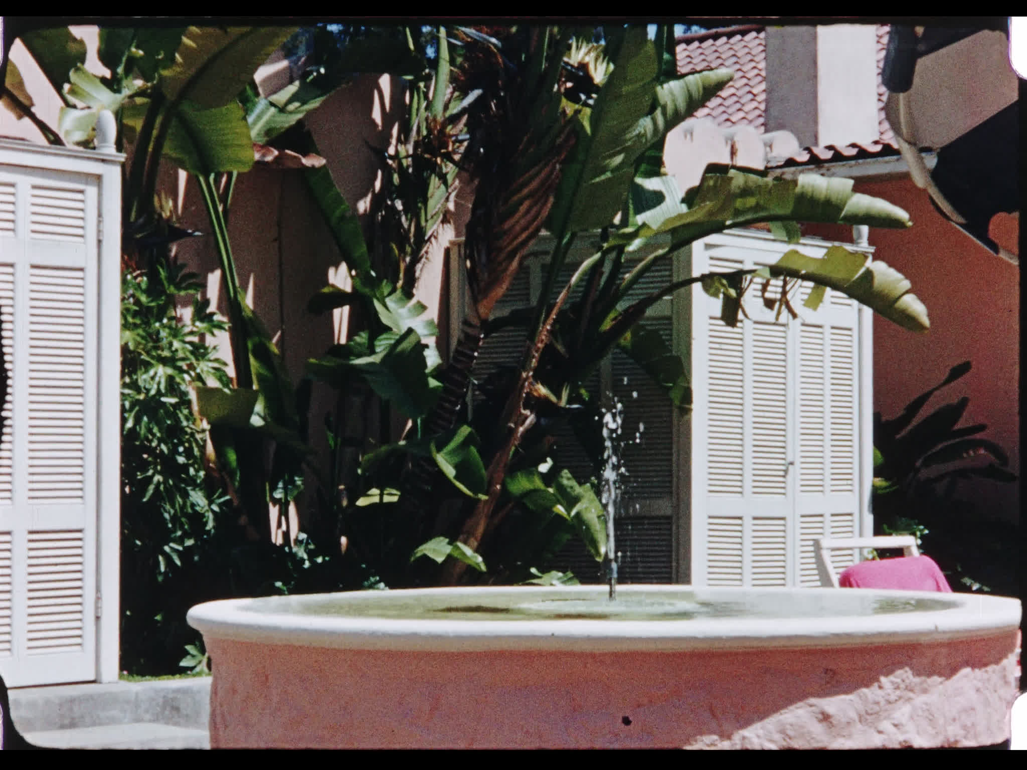 Dirk Bogarde Lounging at Hotel Bel-Air