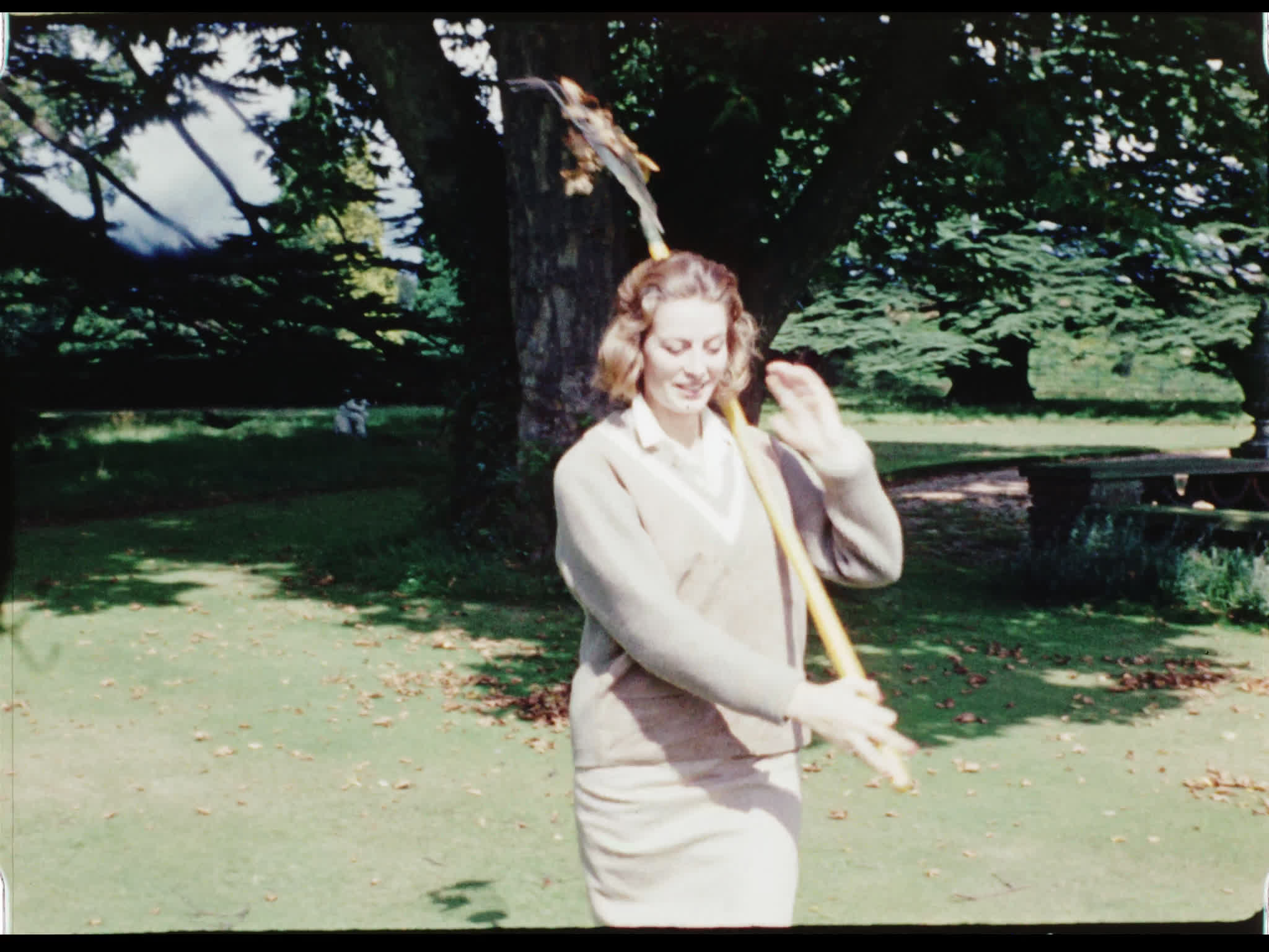 Capucine Raking Leaves Outside Beel House